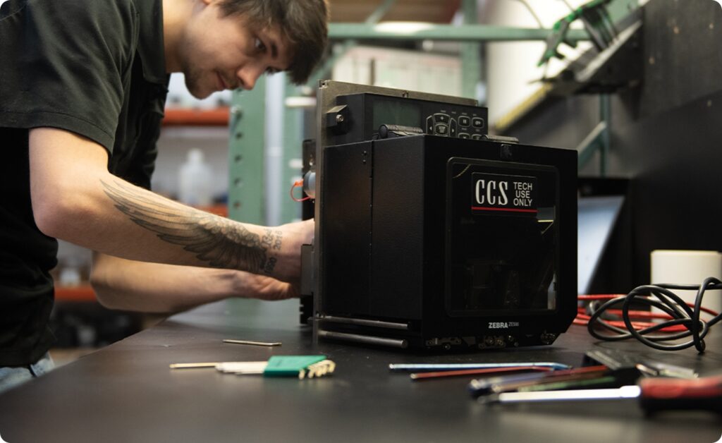 CCS tech working on a system